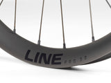Bontrager Line Pro 30 TLR Boost 27.5-inch MTB front wheel in black with tubeless ready rim and no cassette.