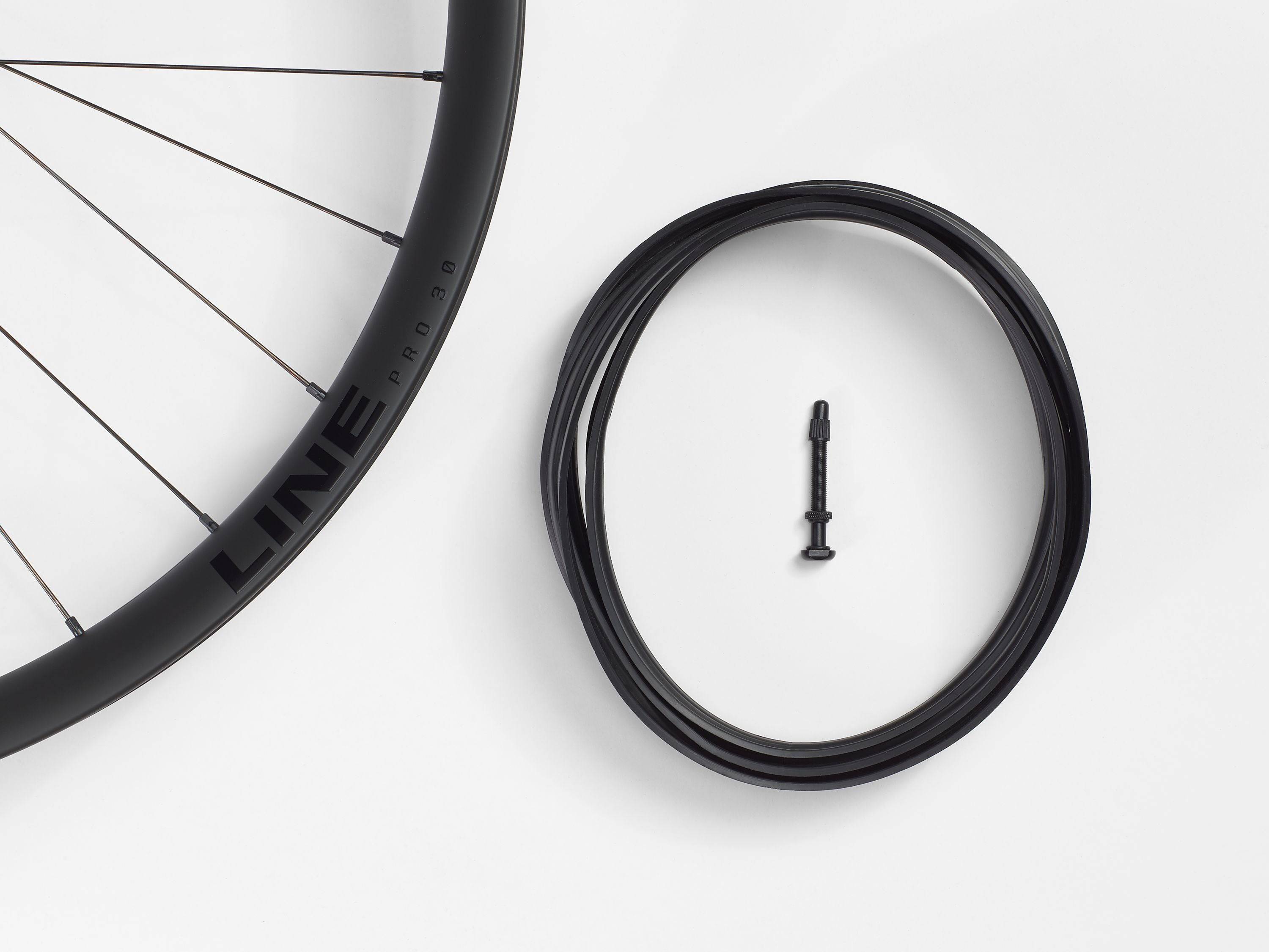 Bontrager Line Pro 30 TLR Boost 27.5-inch MTB front wheel in black with no cassette, showcasing lightweight mountain biking components