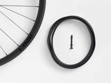 Bontrager Line Pro 30 TLR Boost 27.5-inch MTB front wheel in black with no cassette, showcasing lightweight mountain biking components