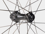Bontrager Paradigm Pro 30 TLR disc road wheel showing aerodynamic rim and tubeless-ready design for high-performance cycling.