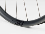 Bontrager Paradigm Pro 30 TLR disc road wheel with tubeless-ready, aerodynamic design for high-performance cycling.