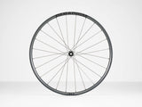 Bontrager Paradigm Pro 30 TLR disc road wheel with tubeless-ready, aerodynamic design, shown mounted on a bicycle.