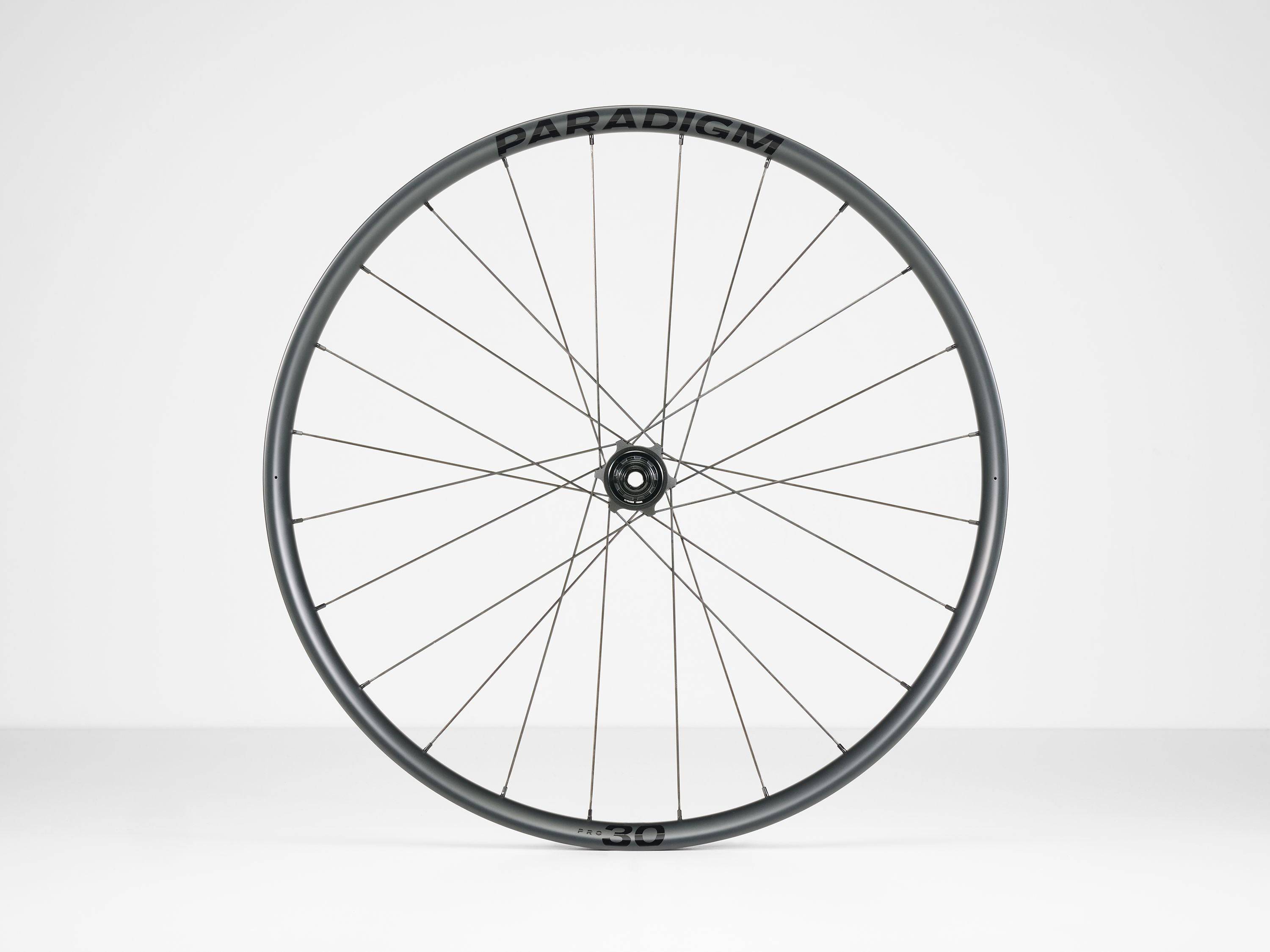 Bontrager Paradigm Pro 30 TLR disc road wheel with aerodynamic design and tubeless-ready rim for high-performance cycling.