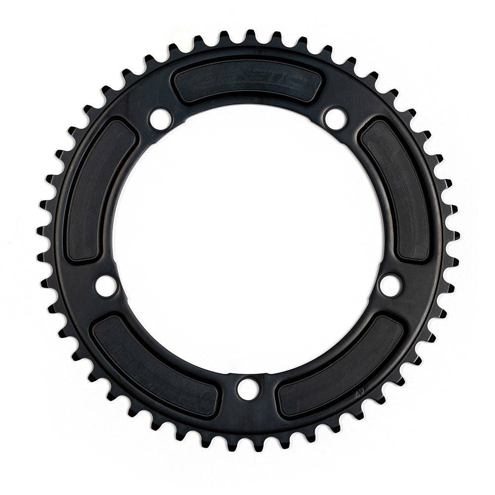 Genetic CNC machined chainring for road bikes, 1/2 x 1/8 inch tibia track chainring component with intricate metal detailing.
