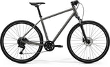 Merida Crossway 100 hybrid bike with 700c wheels, Shimano CUES drivetrain, gray and black frame, ready for versatile riding.