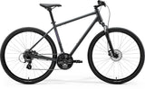 Gray Merida Crossway 10 hybrid bike with Shimano 7-speed gears and disc brakes, featuring a lightweight frame and ergonomic design.