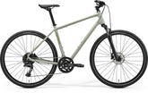 Merida Crossway 300 hybrid bike with gray and green frame, Shimano 10-speed drivetrain, and disc brakes.