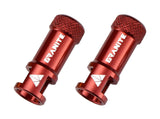 Red Granite JUICY NIPPLE valve cap with removal tool and optional valve stem set, designed for vehicle tire valves.
