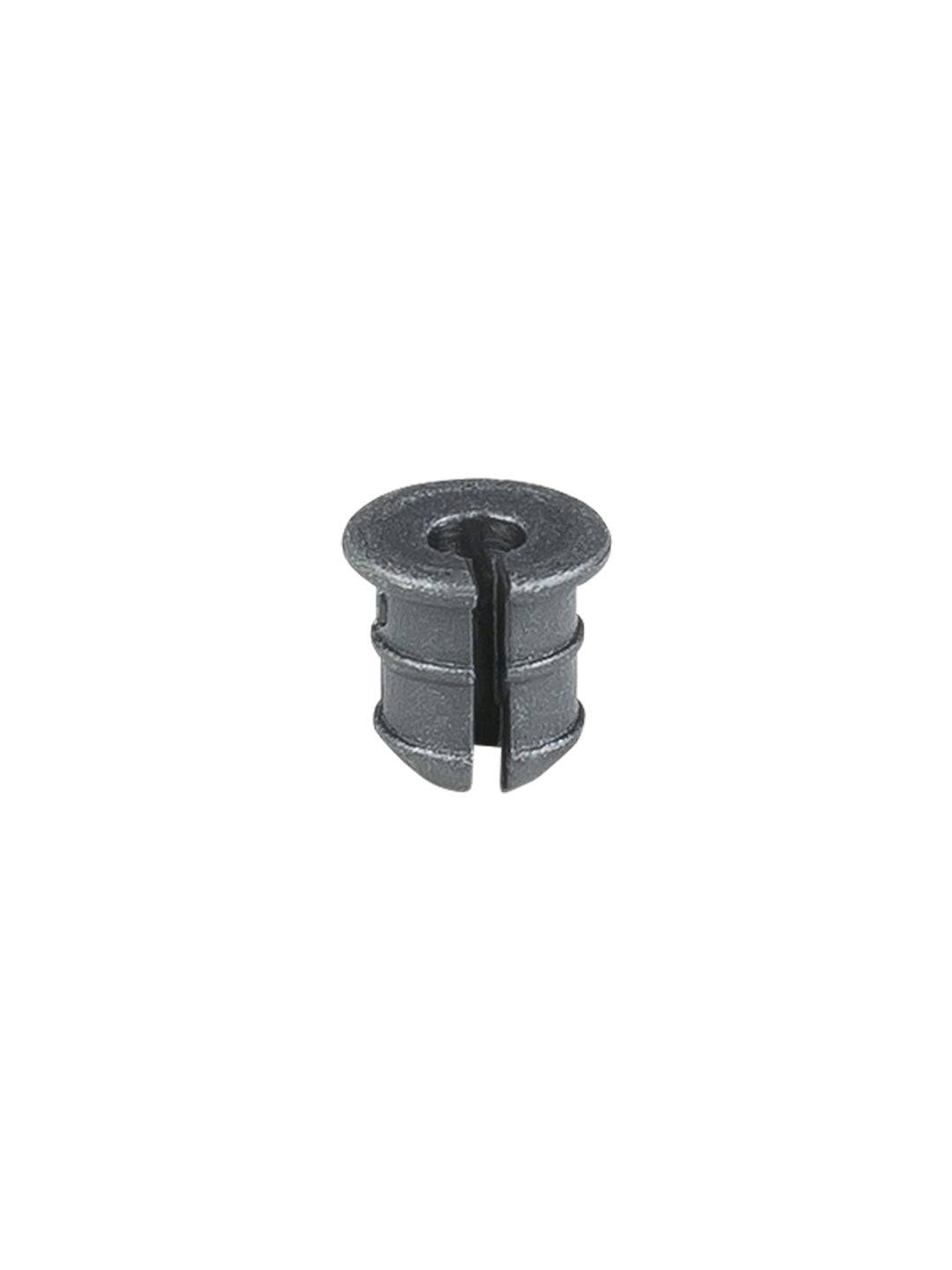 Trek Emonda SL chainstay exit grommets for cable and brake protection, black rubber components on a bicycle frame.