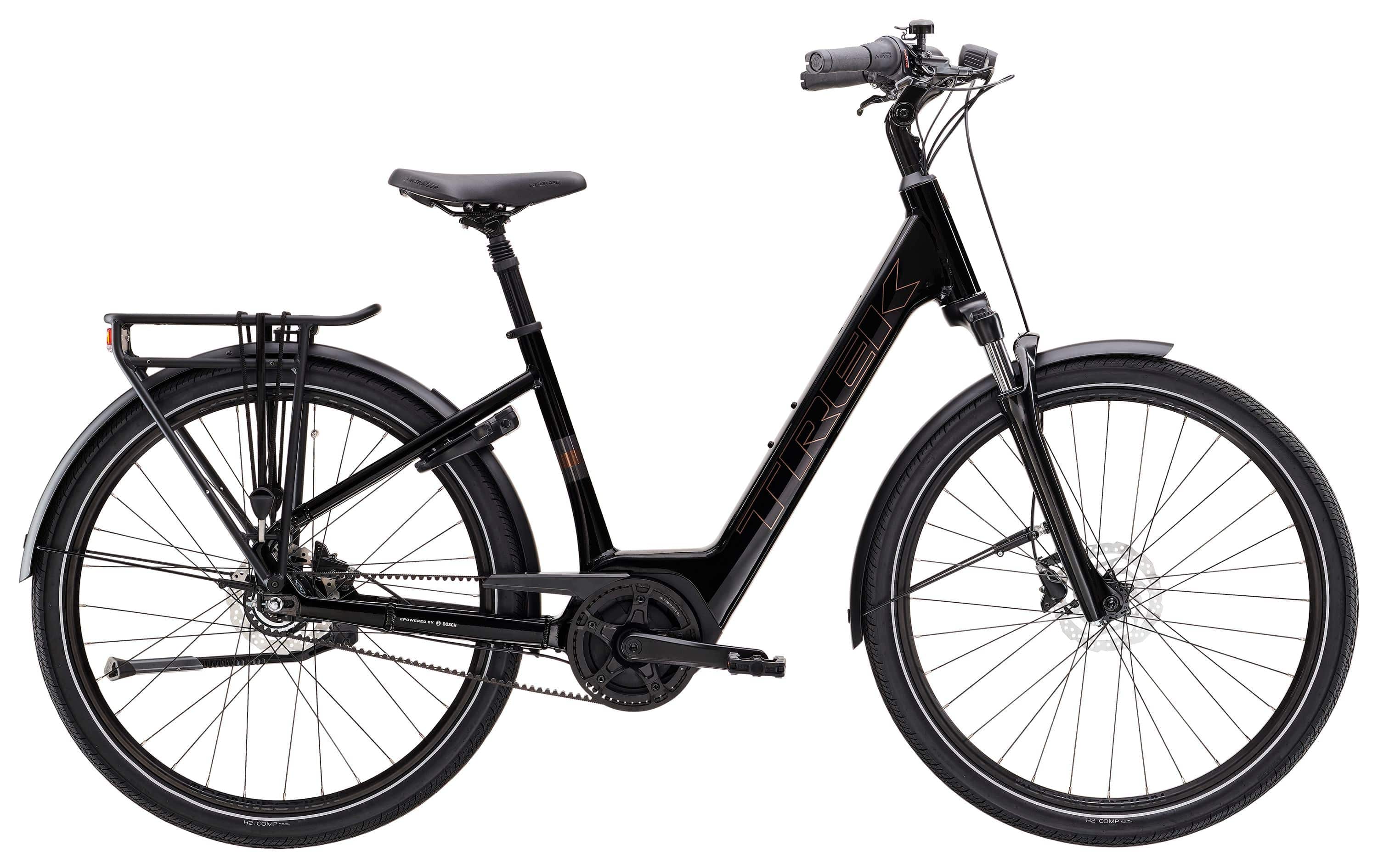 Trek District+ 2 lowstep women's e-hybrid bike for urban commuting with black frame, comfortable saddle, and integrated lighting.