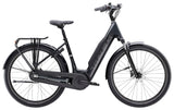 Trek District+ 3 lowstep e-hybrid bike for urban commuting and light trails, featuring a sleek frame and 800Wh battery.