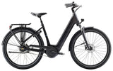 Trek District+ 4 Guard lowstep electric hybrid bike for urban commuting, showing its step-through frame and electric motor.