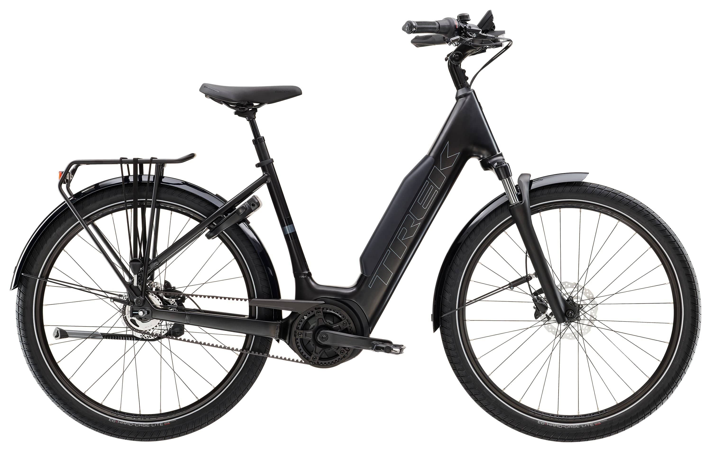 Trek District+ 4 Coaster Belt Lowstep e-bike with Bosch Smart System and Gates belt drive, shown in a city setting.
