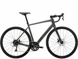 Trek Domane AL 2 Gen 4 road bike with Shimano Claris 8-speed drivetrain and disc brakes, shown from the side on a road.