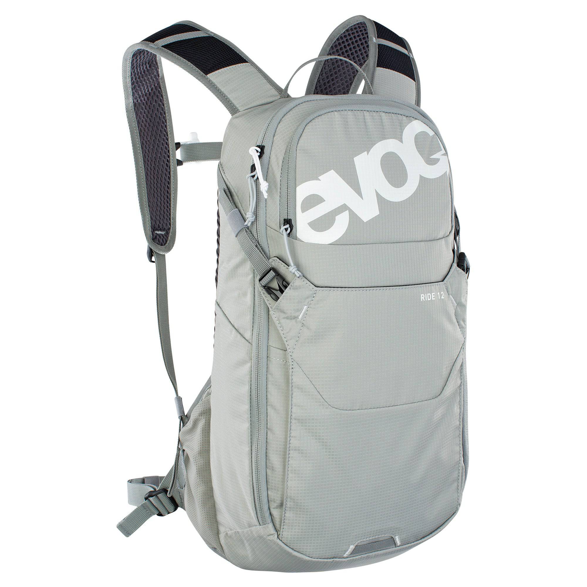 EVOC Ride Performance 12L cycling backpack with hydration system, helmet flap, and adjustable straps for outdoor biking.