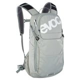 EVOC Ride Performance 12L cycling backpack with hydration system, helmet flap, and adjustable straps for outdoor biking.