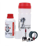 Effetto Mariposa Caffelatex tubeless sealant and repair kit for MTB and road bike wheels, shown in a workshop setting.