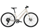 Trek FX 1 Midstep Gen 4 hybrid bike with a step-through frame, suited for urban commuting and trail riding.
