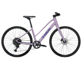 Trek FX 1 Midstep Gen 4 hybrid bike with a step-through frame, suitable for urban commuting and trail riding.