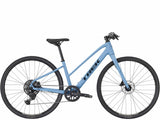 Trek FX 2 Midstep Gen 4 hybrid bike with Shimano CUES drivetrain, featuring a step-through frame for commuting and versatile riding.