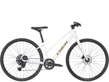 Trek FX 2 Midstep Gen 4 hybrid bike with Shimano CUES drivetrain, black frame, suitable for commuting and versatile riding.