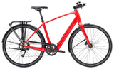 Trek FX+ 2 LT e-hybrid commuter bike with pedal assist, front rack, disc brakes, and a sleek black frame for urban riding.