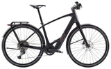Trek FX+ 7 2025 e-hybrid bike with Shimano CUES U6000 system and disc brakes, side view showing frame and wheels.