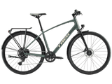 Trek FX Sport AL hybrid bike with lightweight frame, equipped for urban commuting and light trail riding.