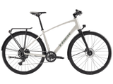 Trek FX Sport AL hybrid bike with step-over frame for urban commuting and light trail riding, featuring lightweight frame and gear components.