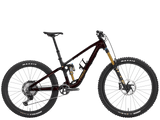 Trek Fuel MX 9.8 XT Gen 7 mountain bike with adjustable suspension and 26-inch wheels for versatile trail riding.