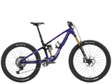 Trek Fuel MX 9.8 XT Gen 7 mountain bike with adjustable suspension, black and red frame, ready for versatile trail riding.