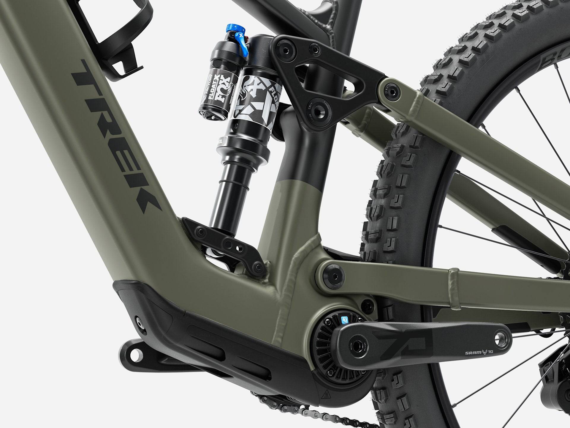 Trek Fuel+ EX 8 Gen 2 e-mountain bike outdoors, showing its frame and suspension for versatile trail riding.