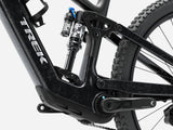 Trek Fuel+ EX 9.7 Gen 2 electric mountain bike with customizable motor assist, black frame, and rugged tires.