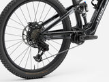 Trek Fuel+ EX 9.7 Gen 2 electric mountain bike with black frame, sturdy tires, and customizable motor assist system.