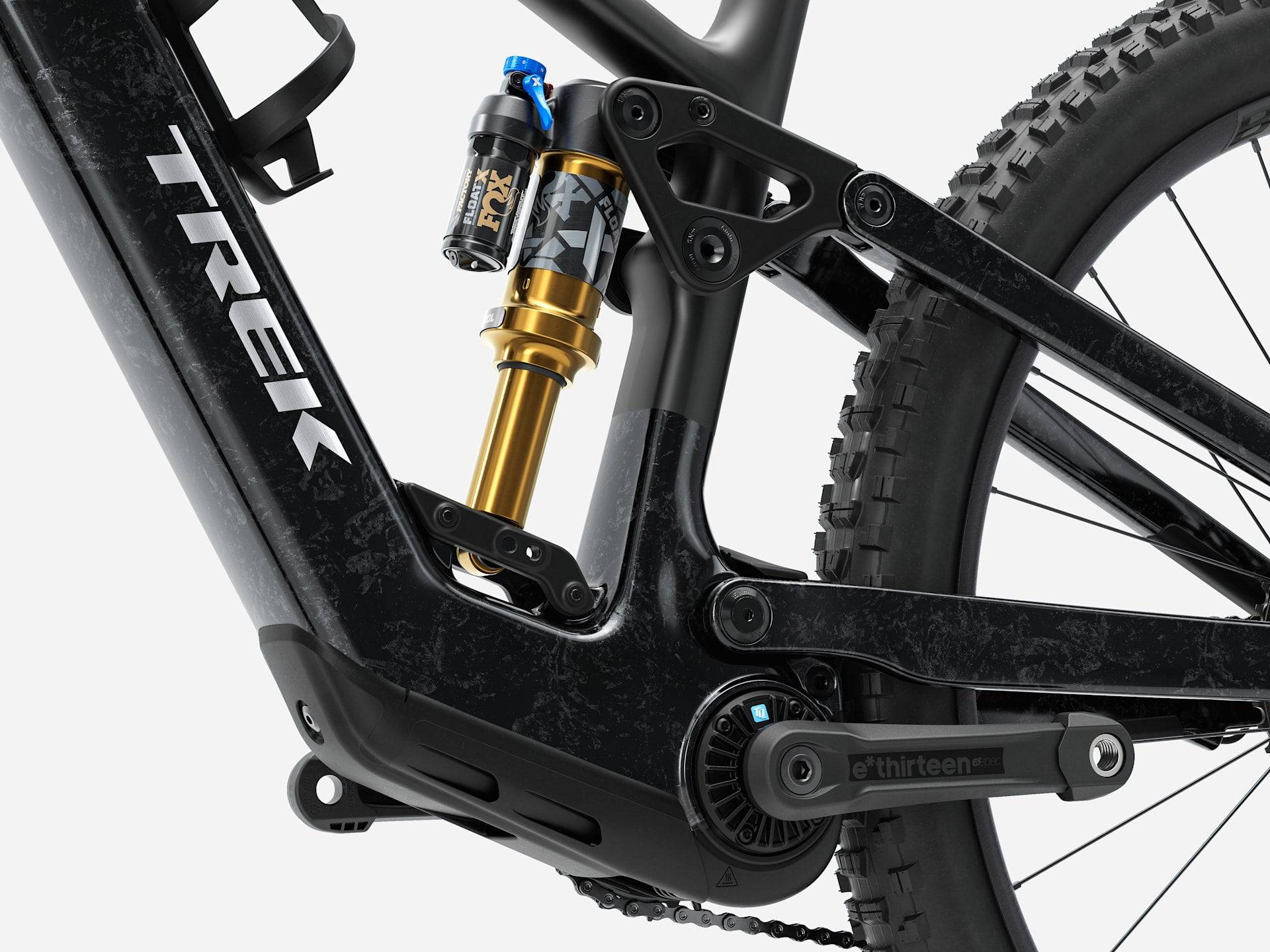 Trek Fuel+ EX 9.8 XT Gen 2 electric mountain bike with black frame, suspension, and knobby tires, ready for off-road riding.