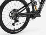 Trek Fuel+ EX 9.8 XT Gen 2 electric mountain bike with adjustable suspension, black frame, and rugged tires.
