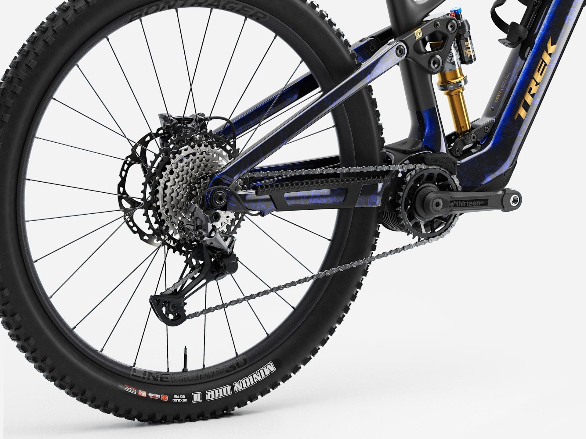 Trek Fuel+ EX 9.8 XT Gen 2 electric mountain bike with adjustable suspension and rugged tires on a trail.