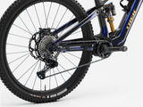 Trek Fuel+ EX 9.8 XT Gen 2 electric mountain bike with adjustable suspension and rugged tires on a trail.