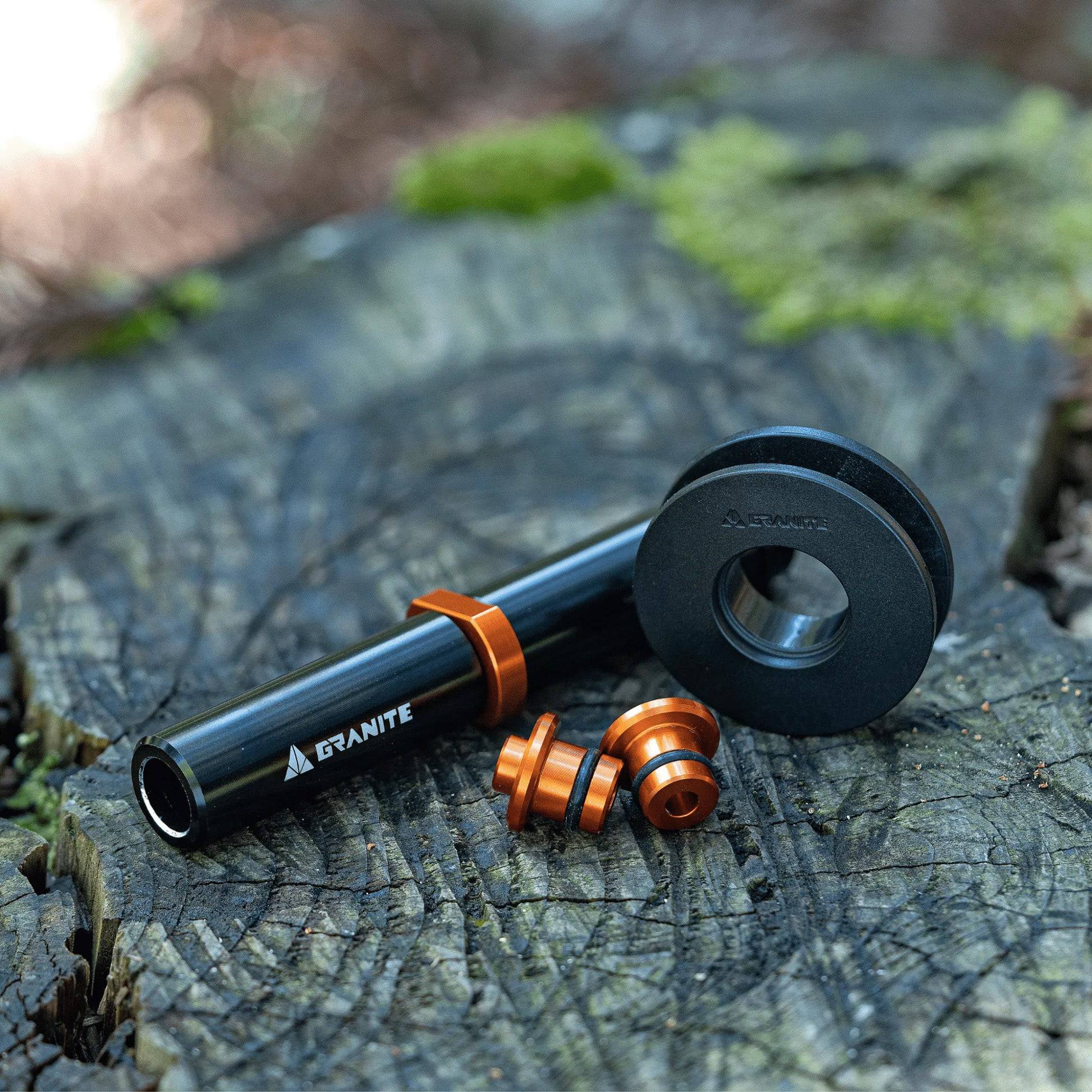 Granite ChainDock Thru Axle Dummy Hub with Chain Hanger for bike transport, black workshop tool for bike maintenance.
