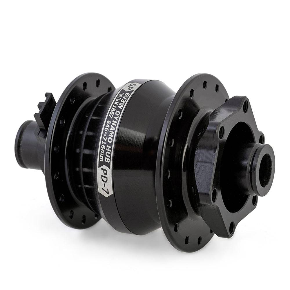 SP Pd-7 Power Dynamo Hub for bikes, 6V 3W German standard hub dynamo, mounted on bicycle wheel.
