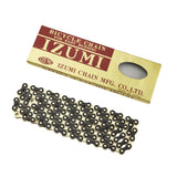 Izumi ES410 JB/G 1/8" 116-link gold and black track chain for fixie and track bikes, showing the chain's detailed design.