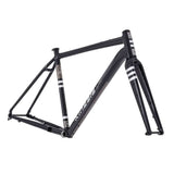 Kinesis UK Tripster AT Plus gravel and road frameset with carbon fork and cargo mounts, featuring a sleek black bike frame.