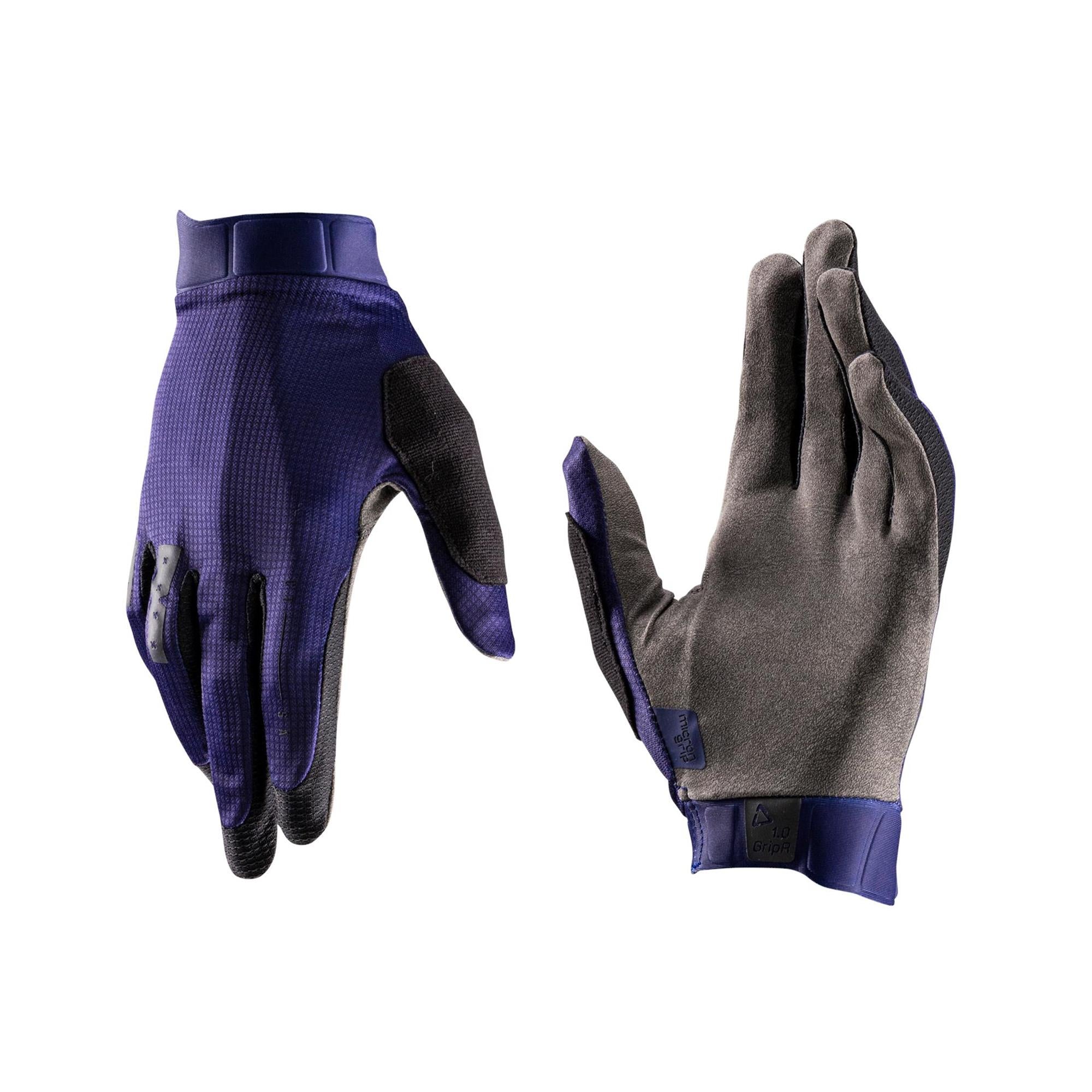 Leatt 1.0 GripR MTB gloves with touchscreen compatibility and breathable fabric shown on a mountain bike rider's hands.