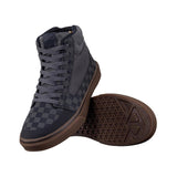 Leatt Hi Flat 1.0 MTB shoes with RideGrip™ sole for pedal support and comfort, shown in black with textured design.