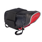 Red and black Lezyne Micro Caddy bike seat pack with compact, durable storage for essentials, attached under a bike saddle