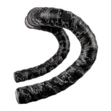 Lizard Skins DSP 3.2mm bar tape with screw-in plugs, featuring carbon camo design for grip and comfort on bicycle handlebars.
