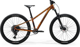 Merida Matts J.Champion MY26 kids' mountain bike with suspension fork and hydraulic disc brakes, black frame and knobby tires.