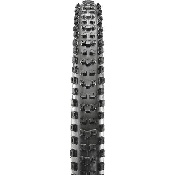 Maxxis Dissector 27.5x2.4 WT tubeless mountain bike tire with aggressive tread and MaxxGrip compound for off-road riding.