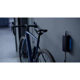 MAHLE X Active Charger with wall mount for X20 and X30 e-bike systems, showing the compact charging unit and mounting hardware.
