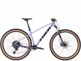 Trek Marlin 6 Gen 3 mountain bike with a black frame, knobby tires, and suspension fork suitable for trail and urban cycling.